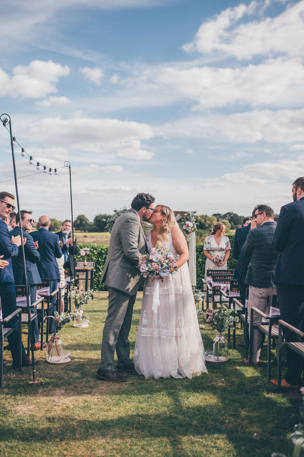Rustic wedding ceremony styling with floral arch